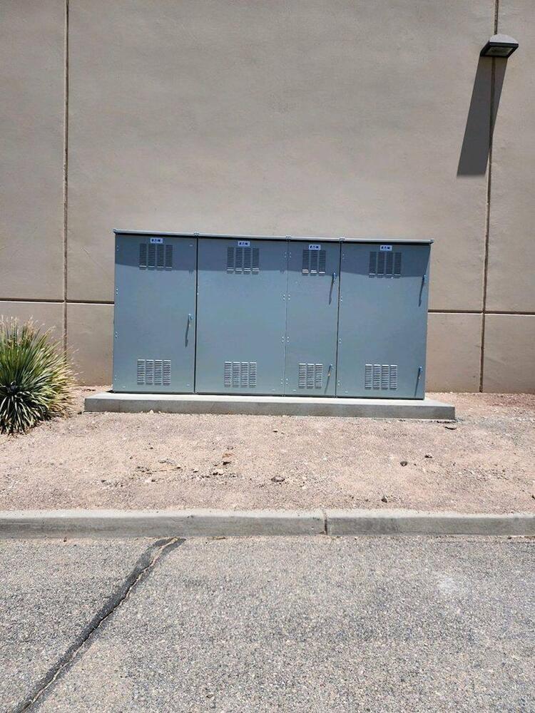Pad-mounted transformer on a completed concrete pad